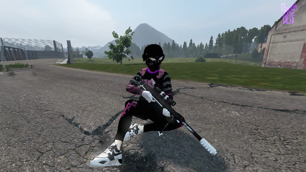 Crashout player sitting mid-road with a rifle